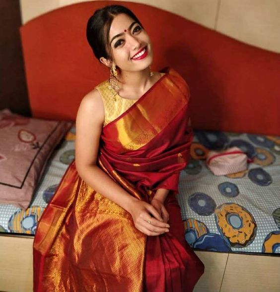 actress in red silk sari